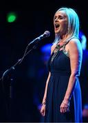 27 April 2025; Edel Nic Éanaigh sings Amhrán na bhFiann before the 2025 Scór Sinsear All-Ireland Finals at the TF Theatre in Castlebar, Mayo. Photo by Shauna Clinton/Sportsfile