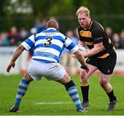 27 April 2025; Scott Neale of County Carlow in action against Teodor Ciobanu of Athy during the Bank of Ireland Provincial Towns Cup final match between Athy RFC and County Carlow FC at Forenaughts in Naas, Kildare. Photo by Seb Daly/Sportsfile
