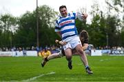 27 April 2025; Tadgh Foley of Athy is tackled by Rhys Edghill of County Carlow during the Bank of Ireland Provincial Towns Cup final match between Athy RFC and County Carlow FC at Forenaughts in Naas, Kildare. Photo by Seb Daly/Sportsfile