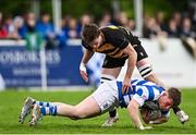 27 April 2025; Jack Henry of Athy is tackled by Joel Brown of County Carlow during the Bank of Ireland Provincial Towns Cup final match between Athy RFC and County Carlow FC at Forenaughts in Naas, Kildare. Photo by Seb Daly/Sportsfile
