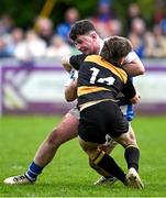 27 April 2025; Niall O'Hanlon of Athy is tackled by Jonathan Crossley of County Carlow during the Bank of Ireland Provincial Towns Cup final match between Athy RFC and County Carlow FC at Forenaughts in Naas, Kildare. Photo by Seb Daly/Sportsfile