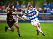 27 April 2025; David Downey of Athy evades the tackle of County Carlow's Sean Quinlan during the Bank of Ireland Provincial Towns Cup final match between Athy RFC and County Carlow FC at Forenaughts in Naas, Kildare. Photo by Seb Daly/Sportsfile