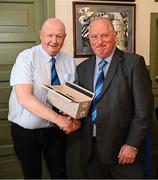 27 April 2025; Provincial Towns Cup tournament director Bill Duggan presents a gift to MC Dermot O’Mahony before the Bank of Ireland Provincial Towns Cup final match between Athy RFC and County Carlow FC at Forenaughts in Naas, Kildare. Photo by Seb Daly/Sportsfile