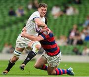 27 April 2025; John Forde of Cork Constitution is tackled by Aaron Coleman of Clontarf during the Energia All-Ireland League Men's Division 1A final match between Clontarf and Cork Constitution at the Aviva Stadium in Dublin. Photo by Matt Browne/Sportsfile