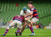 27 April 2025; Sean Duffy of Cork Constitution is tackled by Callum Smith and Aaron Coleman of Clontarf during the Energia All-Ireland League Men's Division 1A final match between Clontarf and Cork Constitution at the Aviva Stadium in Dublin. Photo by Matt Browne/Sportsfile