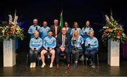 27 April 2025; The Naomh Dominic team, including Anne Gillespie, Breege Kenny, Cathy Dervan, Laura Leonard, Noel Dervan, Stephen Murphy, Sylvia Kilcline and Thomas Hurley, representing Roscommon and Connacht, are presented with their trophy by Uachtarán Chumann Lúthchleas Gael Jarlath Burns, Cathaoirleach Coiste Náisiúnta Scór Paula Magee and Oifigeach Forbartha Gaeilge Jamie Ó Tuama after their victory in the Nuachleas competition during the 2025 Scór Sinsear All-Ireland Finals at the TF Theatre in Castlebar, Mayo. Photo by Shauna Clinton/Sportsfile