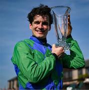 29 April 2025; Jockey Danny Mullins with the trophy after winning The GR1 Dooley Insurance Group Champion Novice Chase onboard Champ Kiely during day one of the Punchestown Festival at Punchestown Racecourse in Kildare. Photo by David Fitzgerald/Sportsfile