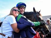 29 April 2025; Jockey Danny Mullins and owner Margaret Masterson with Champ Kiely after winning The GR1 Dooley Insurance Group Champion Novice Chase during day one of the Punchestown Festival at Punchestown Racecourse in Kildare. Photo by David Fitzgerald/Sportsfile
