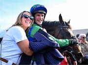29 April 2025; Jockey Danny Mullins and owner Margaret Masterson with Champ Kiely after winning The GR1 Dooley Insurance Group Champion Novice Chase during day one of the Punchestown Festival at Punchestown Racecourse in Kildare. Photo by David Fitzgerald/Sportsfile