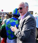 29 April 2025; Jockey Danny Mullins and owner Mick Masterson after winning The GR1 Dooley Insurance Group Champion Novice Chase with Champ Kiely during day one of the Punchestown Festival at Punchestown Racecourse in Kildare. Photo by David Fitzgerald/Sportsfile