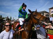 29 April 2025; Jockey Danny Mullins celebrates onboard Champ Kiely after winning The GR1 Dooley Insurance Group Champion Novice Chase during day one of the Punchestown Festival at Punchestown Racecourse in Kildare. Photo by David Fitzgerald/Sportsfile