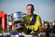 29 April 2025; Jockey Sean Flanagan with the trophy after winning The William Hill Champion Chase on Marine Nationale on day one of the Punchestown Festival at Punchestown Racecourse in Kildare. Photo by David Fitzgerald/Sportsfile