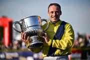 29 April 2025; Jockey Sean Flanagan celebrates with the trophy after winning The William Hill Champion Chase on Marine Nationale on day one of the Punchestown Festival at Punchestown Racecourse in Kildare. Photo by David Fitzgerald/Sportsfile