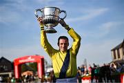 29 April 2025; Jockey Sean Flanagan celebrates with the trophy after winning The William Hill Champion Chase on Marine Nationale on day one of the Punchestown Festival at Punchestown Racecourse in Kildare. Photo by David Fitzgerald/Sportsfile