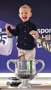 29 April 2025; Jack Connell, aged three, grandson of winning trainer Barry Connell, celebrates in the trophy after his grandfather won The William Hill Champion Chase with Marine Nationale on day one of the Punchestown Festival at Punchestown Racecourse in Kildare. Photo by David Fitzgerald/Sportsfile