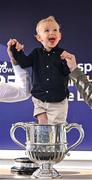 29 April 2025; Jack Connell, aged three, grandson of winning trainer Barry Connell, celebrates in the trophy after his grandfather won The William Hill Champion Chase with Marine Nationale on day one of the Punchestown Festival at Punchestown Racecourse in Kildare. Photo by David Fitzgerald/Sportsfile