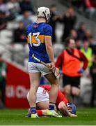 27 April 2025; Seán O’Donoghue of Cork lies on the pitch after an incident with Darragh McCarthy of Tipperary, for which McCarthy was shown a red card, during the Munster GAA Hurling Senior Championship Round 2 match between Cork and Tipperary at SuperValu Páirc Uí Chaoimh in Cork. Photo by Brendan Moran/Sportsfile