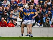 27 April 2025; Darragh McCarthy of Tipperary, 13, is consoled by teammate Noel McGrath after being sent off at the start of the Munster GAA Hurling Senior Championship Round 2 match between Cork and Tipperary at SuperValu Páirc Uí Chaoimh in Cork. Photo by Brendan Moran/Sportsfile