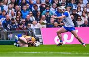 27 April 2025; Adam Hogan of Clare and Dessie Hutchinson of Waterford during the Munster GAA Hurling Senior Championship Round 2 match between Waterford and Clare at Walsh Park in Waterford. Photo by Piaras Ó Mídheach/Sportsfile