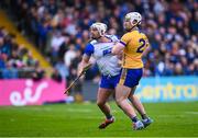 27 April 2025; Adam Hogan of Clare and Dessie Hutchinson of Waterford tussle during the Munster GAA Hurling Senior Championship Round 2 match between Waterford and Clare at Walsh Park in Waterford. Photo by Piaras Ó Mídheach/Sportsfile