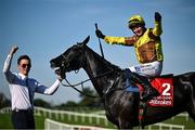 30 April 2025; Paul Townend celebrates on Galopin Des Champs, along with groom Adam Connolly, after winning the Ladbrokes Punchestown Gold Cup Chase on day two of the Punchestown Festival at Punchestown Racecourse in Kildare. Photo by David Fitzgerald/Sportsfile