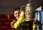 30 April 2025; Paul Townend celebrates with the cup after winning the Ladbrokes Punchestown Gold Cup Chase on Galopin Des Champs on day two of the Punchestown Festival at Punchestown Racecourse in Kildare. Photo by David Fitzgerald/Sportsfile