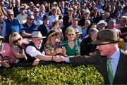 30 April 2025; Trainer Willie Mullins is congratulated by spectators after winning the Ladbrokes Punchestown Gold Cup Chase with Galopin Des Champs on day two of the Punchestown Festival at Punchestown Racecourse in Kildare. Photo by David Fitzgerald/Sportsfile