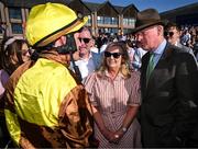 30 April 2025; Jockey Paul Townend with Greg and Audrey Turley, owner of Galopin Des Champs, and trainer Willie Mullins after winning the Ladbrokes Punchestown Gold Cup Chase on day two of the Punchestown Festival at Punchestown Racecourse in Kildare. Photo by David Fitzgerald/Sportsfile