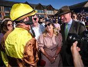 30 April 2025; Jockey Paul Townend with Greg and Audrey Turley, owner of Galopin Des Champs, and trainer Willie Mullins after winning the Ladbrokes Punchestown Gold Cup Chase on day two of the Punchestown Festival at Punchestown Racecourse in Kildare. Photo by David Fitzgerald/Sportsfile