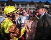 30 April 2025; Jockey Paul Townend with Greg and Audrey Turley, owner of Galopin Des Champs, and trainer Willie Mullins after winning the Ladbrokes Punchestown Gold Cup Chase on day two of the Punchestown Festival at Punchestown Racecourse in Kildare. Photo by David Fitzgerald/Sportsfile