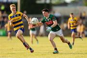 30 April 2025; Cathal Keaveney of Mayo in action against Eoghan Carthy of Roscommon during the Dalata Hotel Group Connacht GAA Football U20 Championship final match between Mayo and Roscommon at Tuam Stadium in Galway. Photo by Thomas Flinkow/Sportsfile