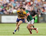 30 April 2025; Rory Carthy of Roscommon in action against Yousif Coghill of Mayo during the Dalata Hotel Group Connacht GAA Football U20 Championship final match between Mayo and Roscommon at Tuam Stadium in Galway. Photo by Thomas Flinkow/Sportsfile