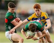 30 April 2025; Brian Greene of Roscommon tackles Oisin Cronin of Mayo during the Dalata Hotel Group Connacht GAA Football U20 Championship final match between Mayo and Roscommon at Tuam Stadium in Galway. Photo by Thomas Flinkow/Sportsfile