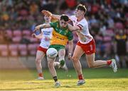 30 April 2025; Conor McGinty of Donegal shoots under pressure from Cónán Devlin of Tyrone during the Dalata Hotel Group Ulster GAA Football U20 Championship final match between Donegal and Tyrone at Owenbeg Derry GAA Centre in Dungiven, Derry. Photo by Piaras Ó Mídheach/Sportsfile