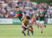 30 April 2025; John McGuinness of Roscommon in action against Paul Gilmore of Mayo during the Dalata Hotel Group Connacht GAA Football U20 Championship final match between Mayo and Roscommon at Tuam Stadium in Galway. Photo by Thomas Flinkow/Sportsfile