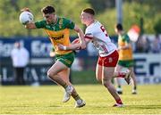 30 April 2025; Kevin Muldoon of Donegal in action against Callum Daly of Tyrone during the Dalata Hotel Group Ulster GAA Football U20 Championship final match between Donegal and Tyrone at Owenbeg Derry GAA Centre in Dungiven, Derry. Photo by Piaras Ó Mídheach/Sportsfile