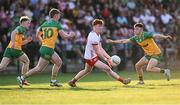 30 April 2025; Conall Sheehy of Tyrone in action against Donegal players Cian McMenamin, 10, and Conor McGinty, right, during the Dalata Hotel Group Ulster GAA Football U20 Championship final match between Donegal and Tyrone at Owenbeg Derry GAA Centre in Dungiven, Derry. Photo by Piaras Ó Mídheach/Sportsfile