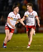 30 April 2025; Tyrone players Eoin McElholm, left, and Ruairí McCullagh celebrate after their side's victory in the Dalata Hotel Group Ulster GAA Football U20 Championship final match between Donegal and Tyrone at Owenbeg Derry GAA Centre in Dungiven, Derry. Photo by Piaras Ó Mídheach/Sportsfile