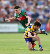 30 April 2025; John McGuinness of Roscommon in action against Paul Gilmore of Mayo during the Dalata Hotel Group Connacht GAA Football U20 Championship final match between Mayo and Roscommon at Tuam Stadium in Galway. Photo by Thomas Flinkow/Sportsfile