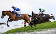 1 May 2025; Busselton, with JJ Slevin, up, left, jumps Ruby's Double on their way to winning the Mongey Communications La Touche Cup Cross Country Steeplechase during day three of the Punchestown Festival at Punchestown Racecourse in Kildare. Photo by Seb Daly/Sportsfile