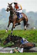1 May 2025; Empire Soldier, with Jamie Lee Scallan up, top, jumps Ruby's Double as Stealthy Tom, with Simon Derek Torrens up, part company during the Mongey Communications La Touche Cup Cross Country Steeplechase during day three of the Punchestown Festival at Punchestown Racecourse in Kildare. Photo by Seb Daly/Sportsfile Photo by Seb Daly/Sportsfile