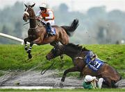 1 May 2025; Stealthy Tom, right, and jockey Simon Torrens fall at Ruby's Double during the Mongey Communications La Touche Cup Cross Country Steeplechase as Empire Soldier, with Jamie Lee Scallan up, clear the jump, on day three of the Punchestown Festival at Punchestown Racecourse in Kildare. Photo by Seb Daly/Sportsfile