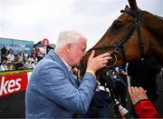 1 May 2025; Winning owner Brian Acheson kisses Teahupoo after the Ladbrokes Champion Stayers Hurdle during day three of the Punchestown Festival at Punchestown Racecourse in Kildare. Photo by Seb Daly/Sportsfile