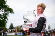 1 May 2025; Jockey Sam Ewing celebrates with the trophy after winning the Ladbrokes Champion Stayers Hurdle race on Teahupoo during day three of the Punchestown Festival at Punchestown Racecourse in Kildare. Photo by Seb Daly/Sportsfile