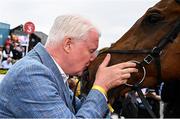 1 May 2025; Owner Brian Acheson and Teahupoo after winning the Ladbrokes Champion Stayers Hurdle during day three of the Punchestown Festival at Punchestown Racecourse in Kildare. Photo by Seb Daly/Sportsfile