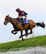 1 May 2025; Benny The Duke, with Frankie Patrick Murphy up, jumps Ruby's Double during the Mongey Communications La Touche Cup Cross Country Steeplechase on day three of the Punchestown Festival at Punchestown Racecourse in Kildare. Photo by Seb Daly/Sportsfile