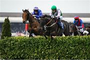 1 May 2025; Busselton, left, with JJ Slevin up, and Vital Island, with Barry Thomas Stone up, jump the Glendalough Drop Hedge during the Mongey Communications La Touche Cup Cross Country Steeplechase on day three of the Punchestown Festival at Punchestown Racecourse in Kildare. Photo by Seb Daly/Sportsfile