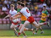 30 April 2025; David Monaghan of Donegal is tackled by Joey Clarke of Tyrone during the Dalata Hotel Group Ulster GAA Football U20 Championship final match between Donegal and Tyrone at Owenbeg Derry GAA Centre in Dungiven, Derry. Photo by Piaras Ó Mídheach/Sportsfile