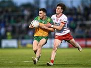 30 April 2025; Kevin Muldoon of Donegal in action against Matthew Quinn of Tyrone during the Dalata Hotel Group Ulster GAA Football U20 Championship final match between Donegal and Tyrone at Owenbeg Derry GAA Centre in Dungiven, Derry. Photo by Piaras Ó Mídheach/Sportsfile