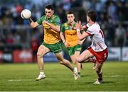 30 April 2025; Kevin Muldoon of Donegal in action against Matthew Quinn of Tyrone during the Dalata Hotel Group Ulster GAA Football U20 Championship final match between Donegal and Tyrone at Owenbeg Derry GAA Centre in Dungiven, Derry. Photo by Piaras Ó Mídheach/Sportsfile